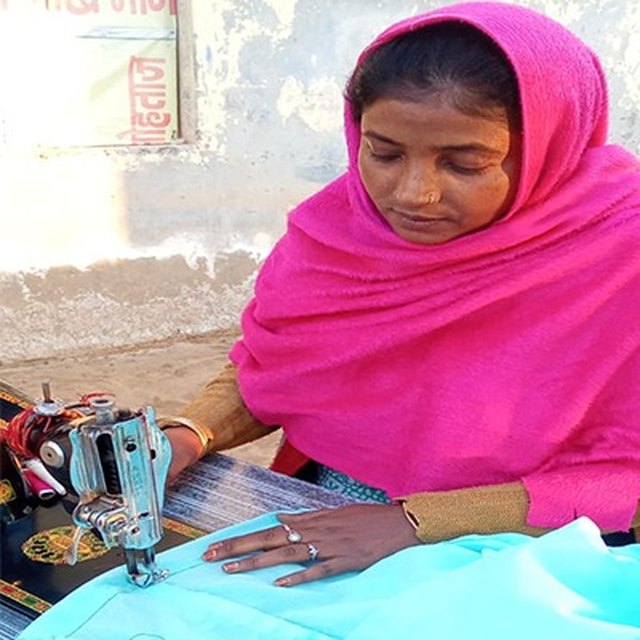 Kiran, an artisan with the PESHAS cluster, at her embroidery