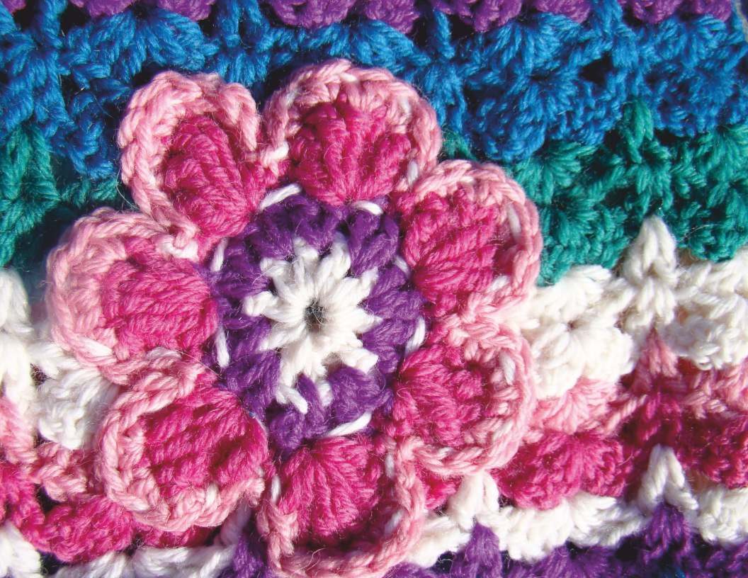 Crochet flowers in pink, purple and teal